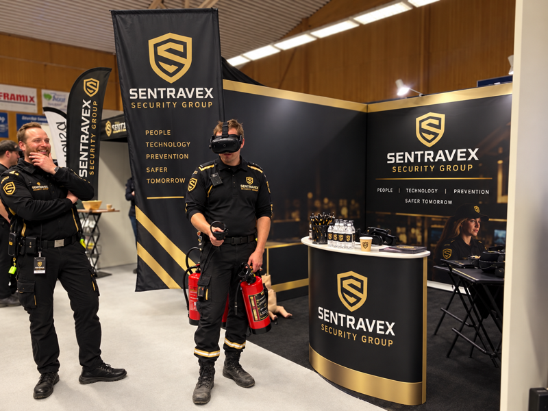 Sentravex team at an event booth with a demonstration