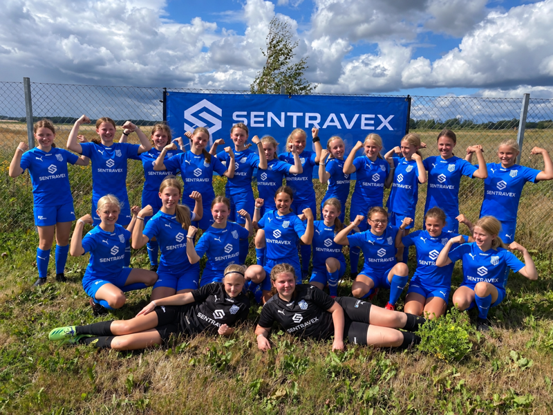 Community youth sports team wearing Sentravex-branded blue uniforms