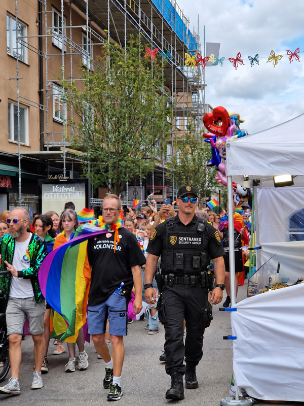 Sentravex event security officer patrolling a busy outdoor community festival