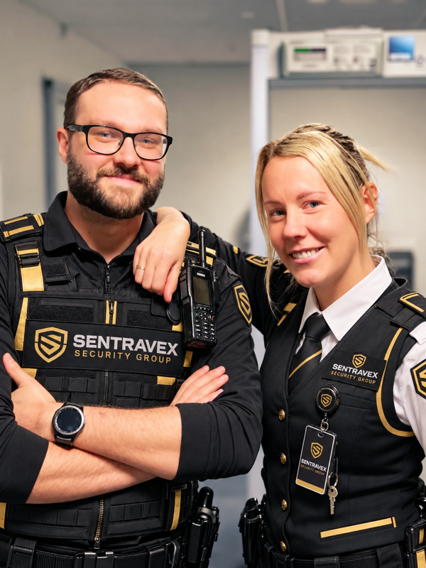 Two Sentravex team members in branded security uniforms